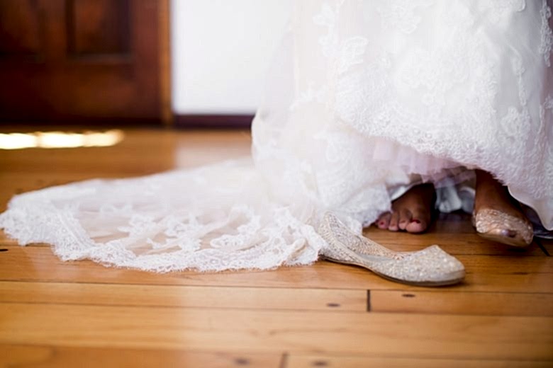 Woman getting dressed on her wedding day