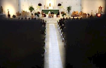 wedding viewed through a cross cutout