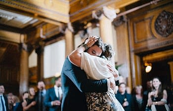 a son and his mom dancing to a mother son dance songs