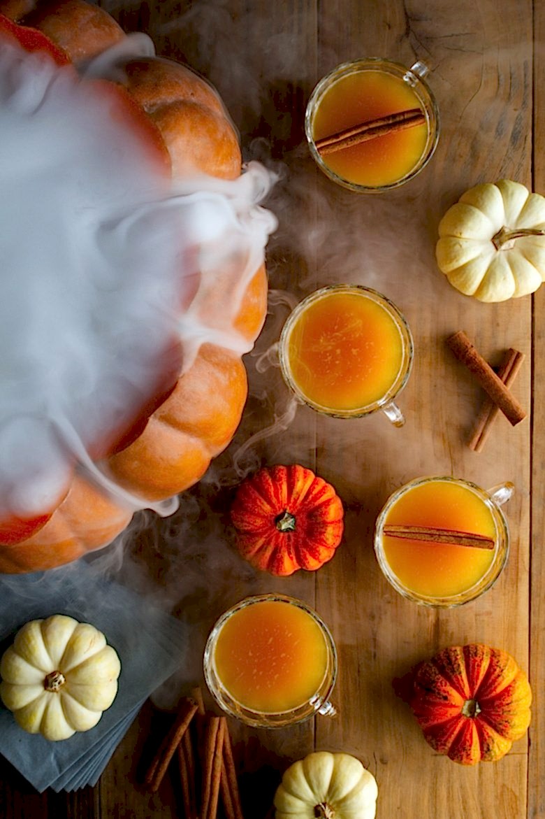 halloween26 - A giant pumpkin spilling dry ice makes a spooky Halloween punch bowl. - Photo credit: HonestlyYUM (can also be used on wire)