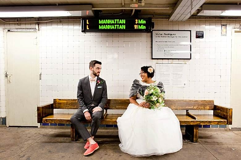bride and groom waiting for the subway