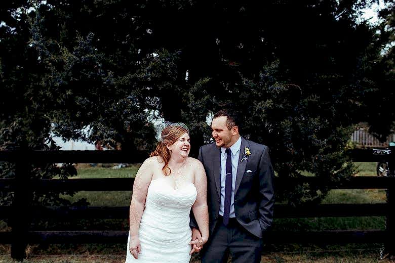 man and woman laughing on wedding day