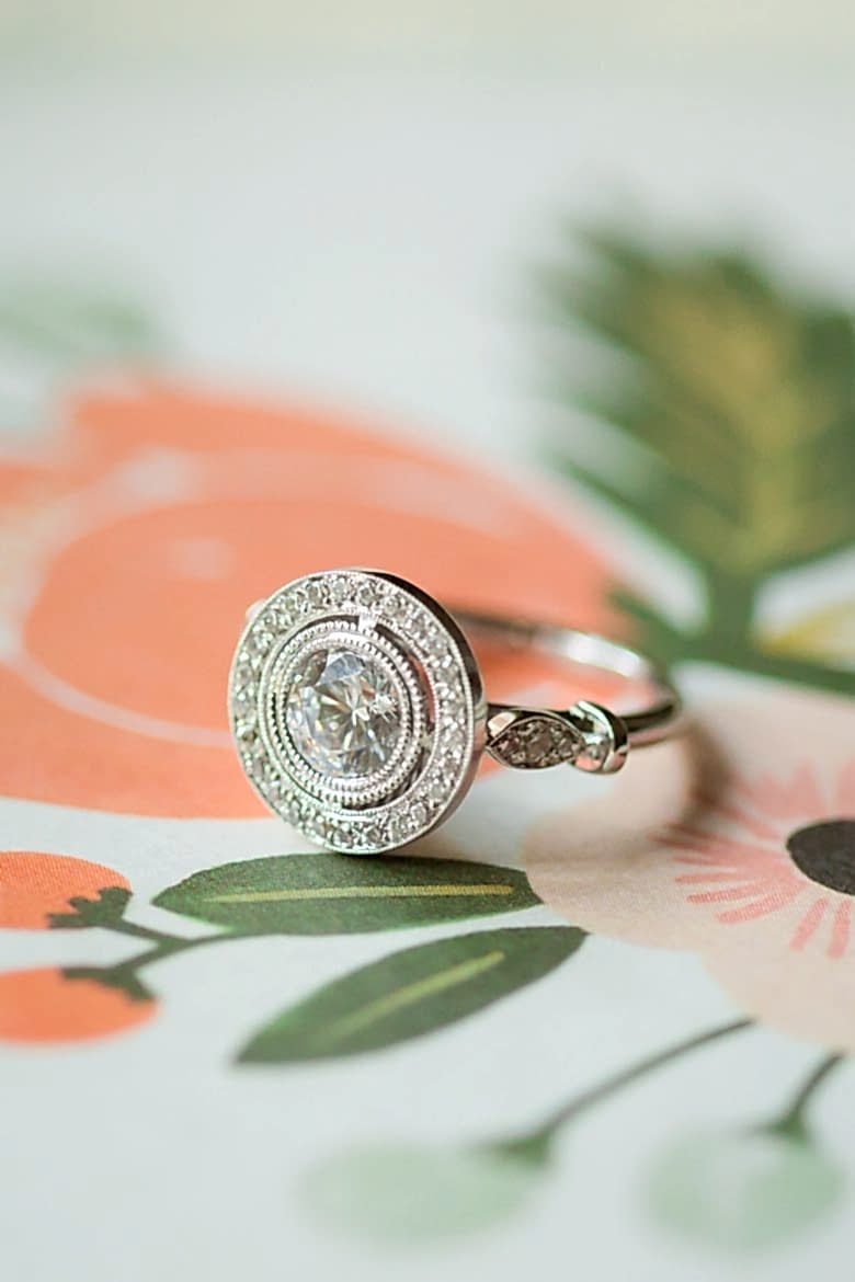 Vintage inspired engagement ring on floral paper