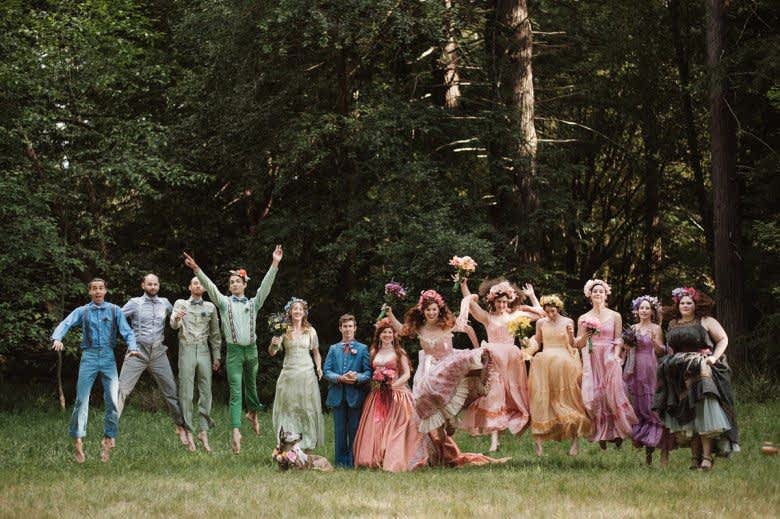 Wedding party lined up and jumping