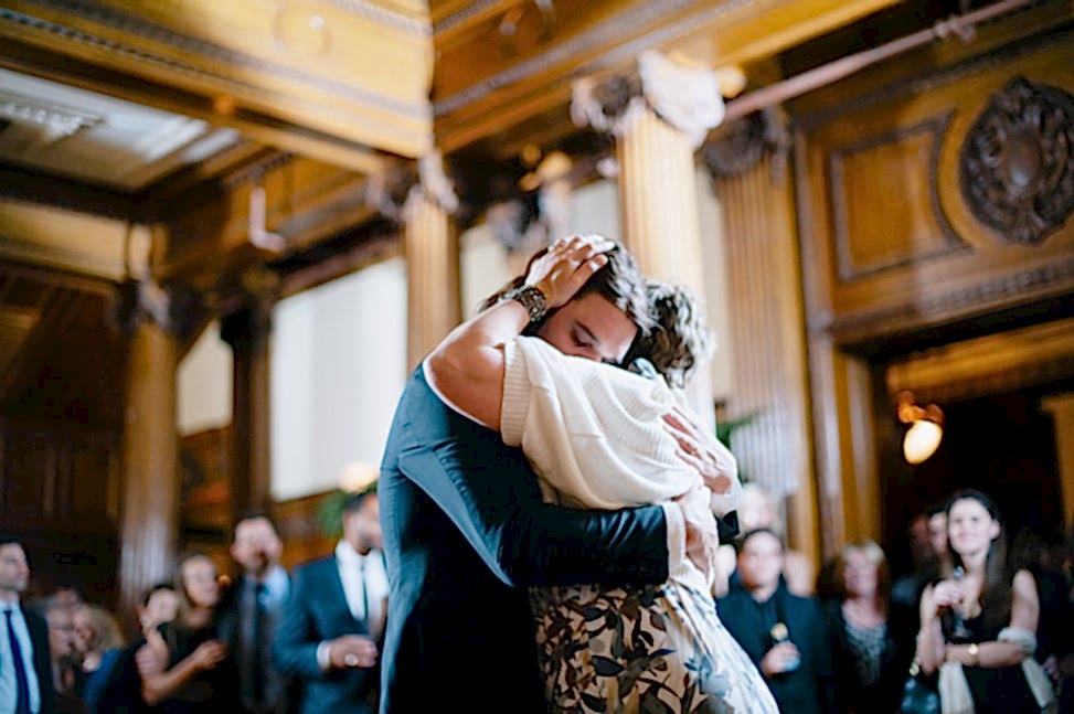 a groom dances with his mother