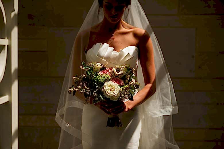 bride standing in shadows