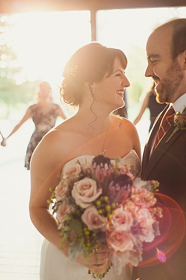 bride and groom dancing and laughing