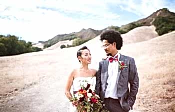 bride and groom looking at one another