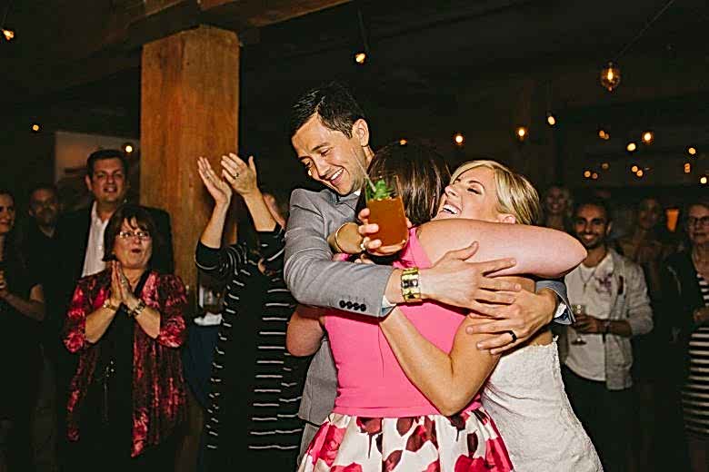 guests embracing at wedding