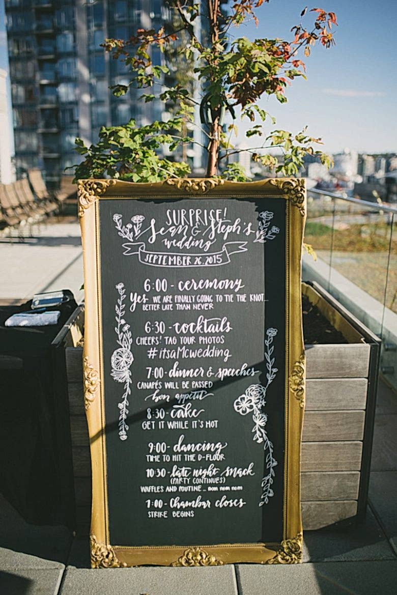 surprise wedding sign decorated with trees