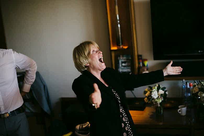 Blonde mom happy with arms open