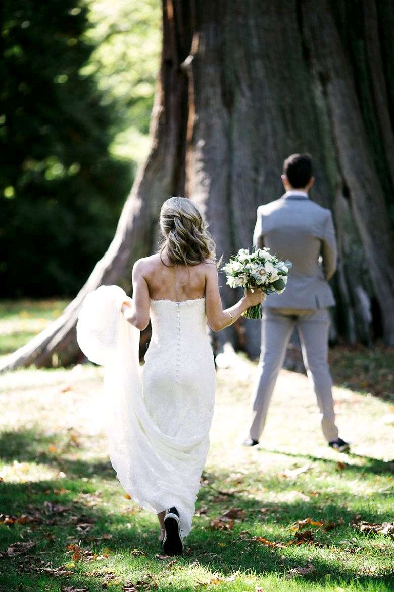 bride walking toward groom for first look
