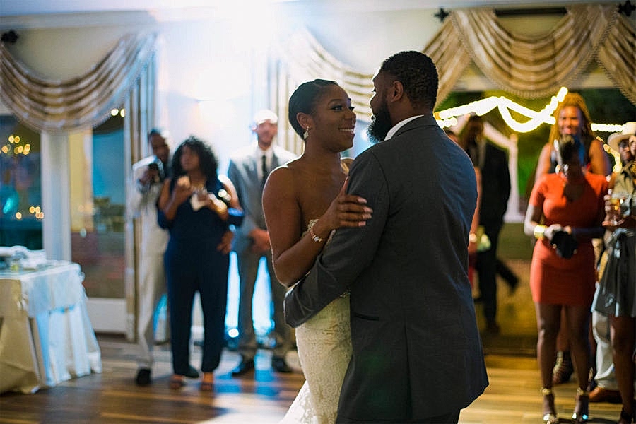 A couple dances their first dance