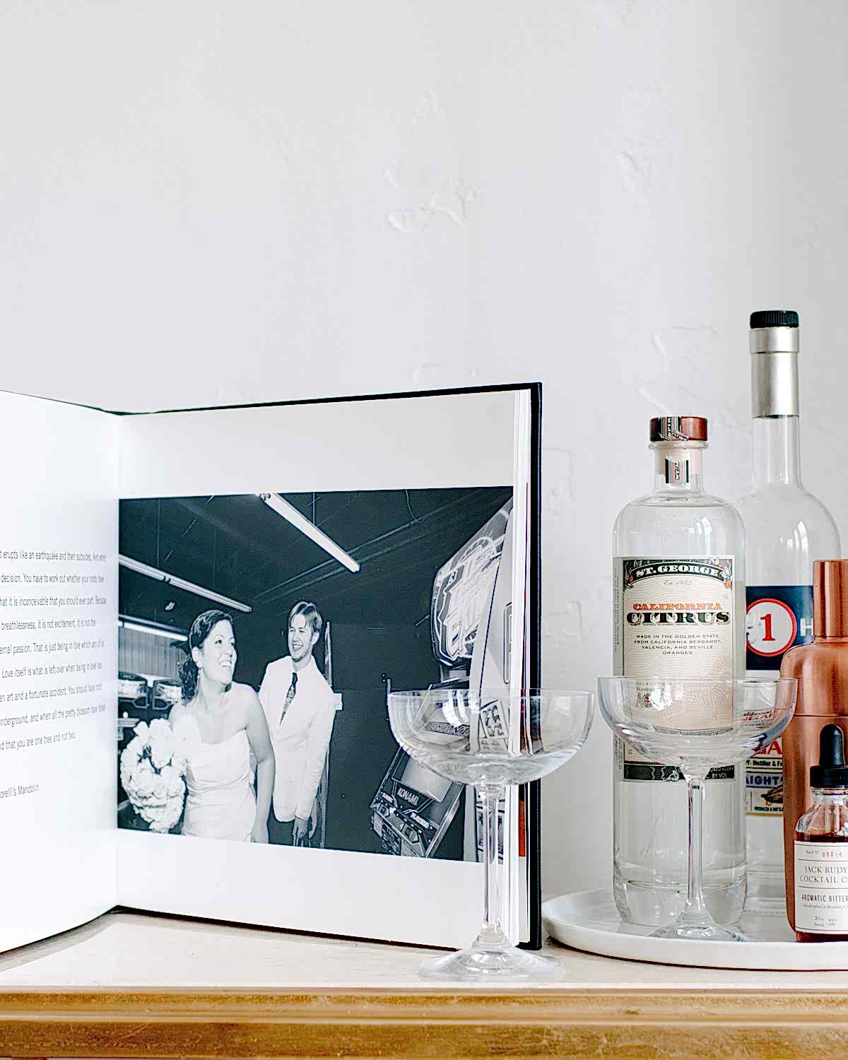 An open album sits along side a bar setup.