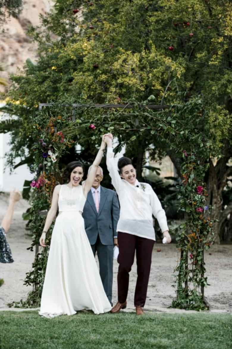 couple celebrating the end of their wedding ceremony