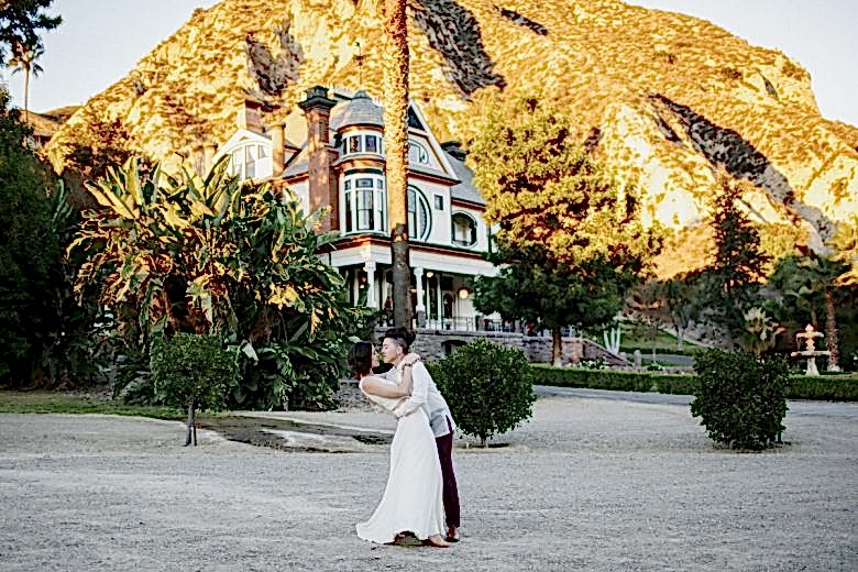 couple kissing one another after wedding ceremony