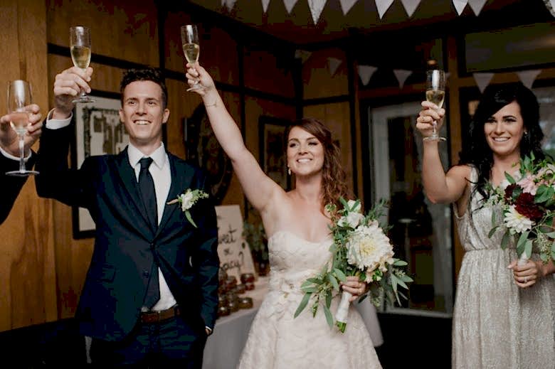 bride and groom toasting