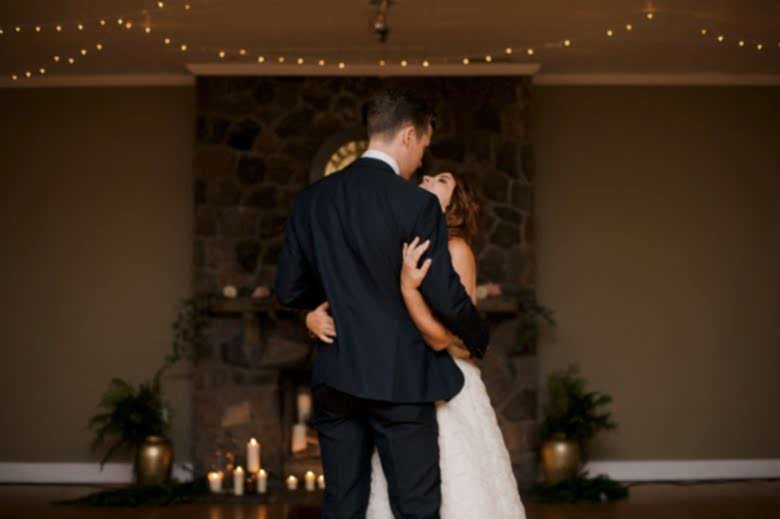 bride and groom dancing together