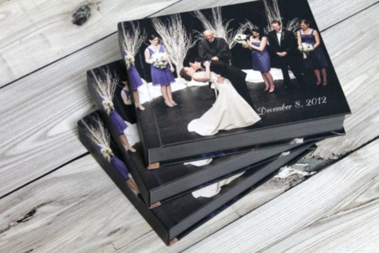 stack of flush mount wedding photo albums