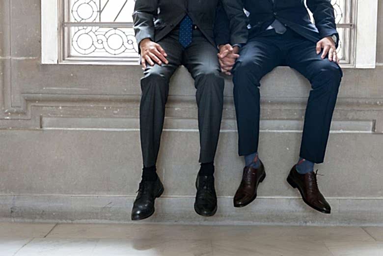 two grooms holding hands