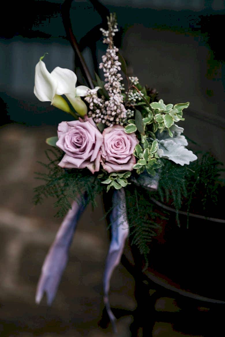 bouquet with calla lilies and purple roses