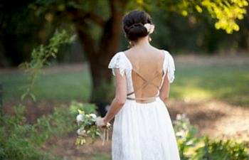 bride standing alone outside