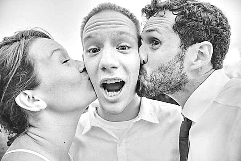 couple kissing friend on the cheek