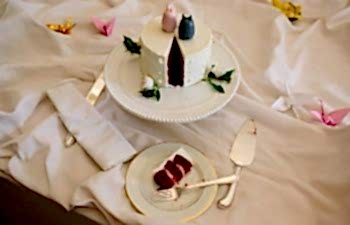 table with slice of wedding cake