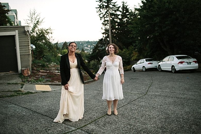 two women in white wedding dreses eloping in seattle