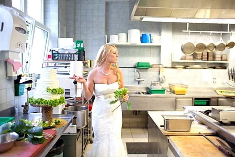 bride in kitchen with cake and flowers