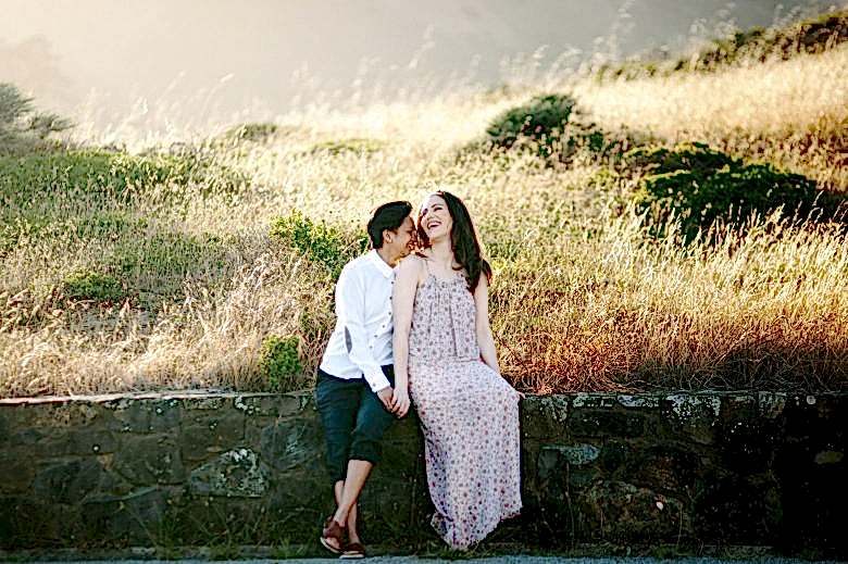 two women sitting together and in love