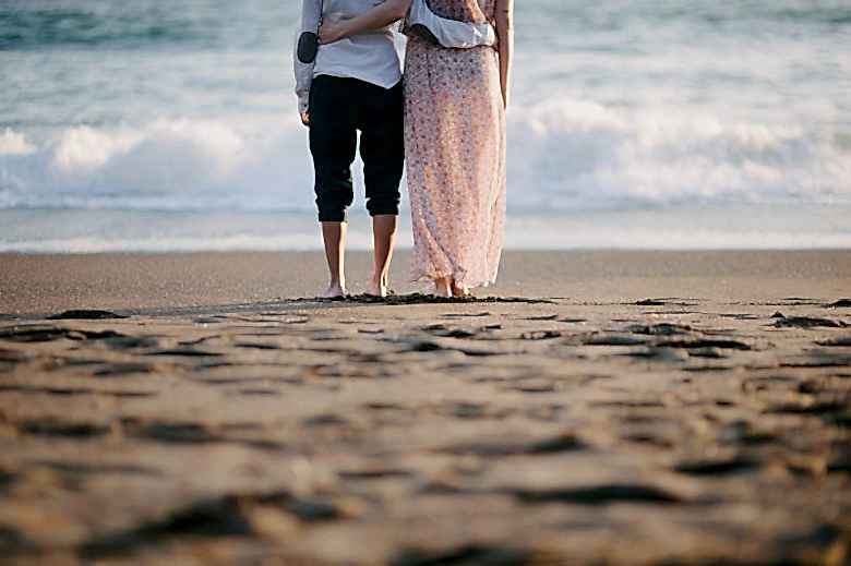 couple standing together at the beach