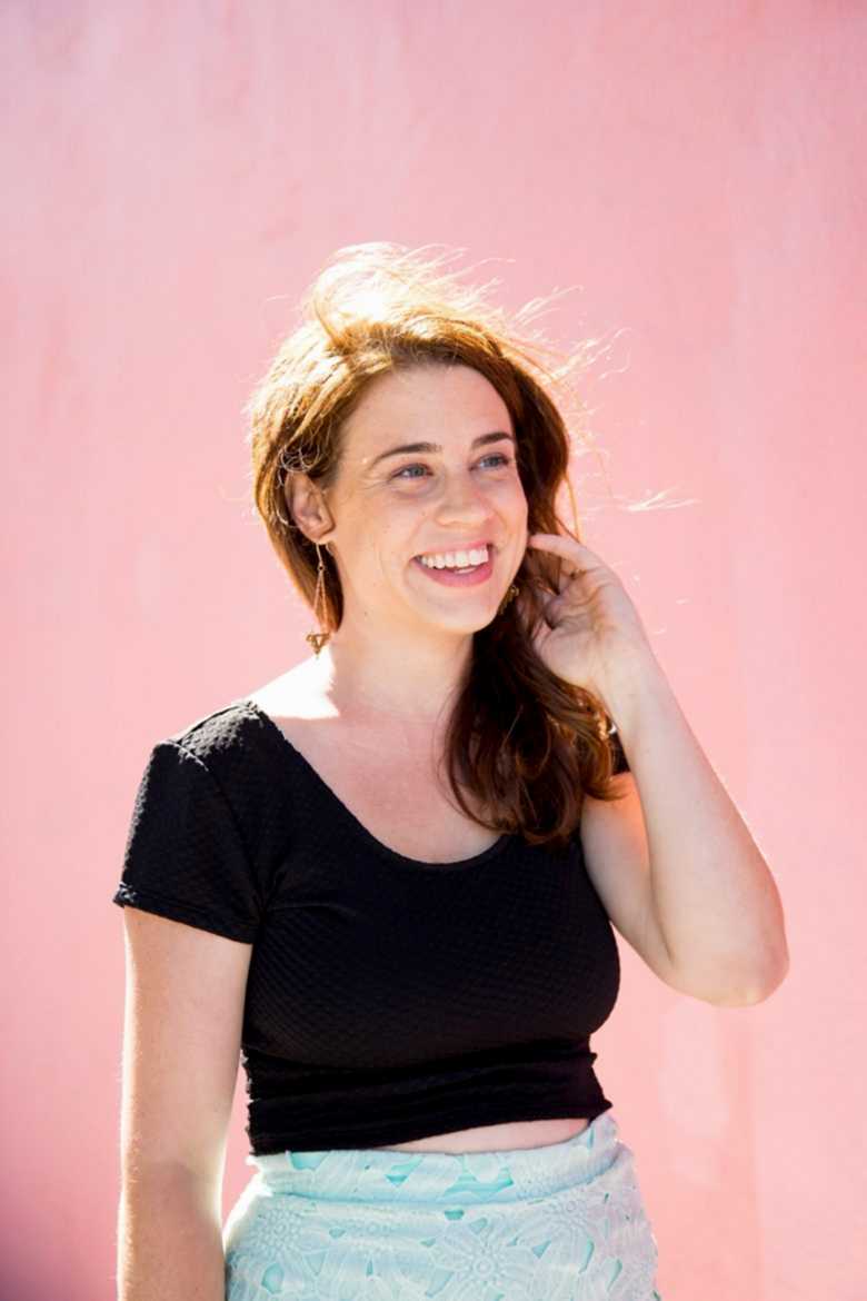 photo of Meg Keene in front of pink wall