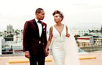 A wedding couple walk together