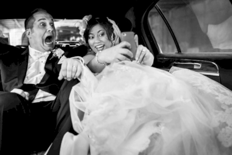 bride and groom taking a selfie