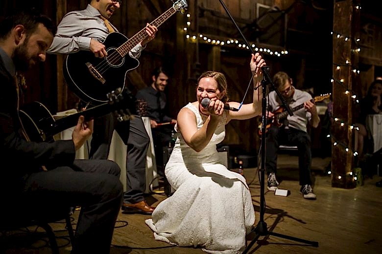 bride singing at her wedding reception
