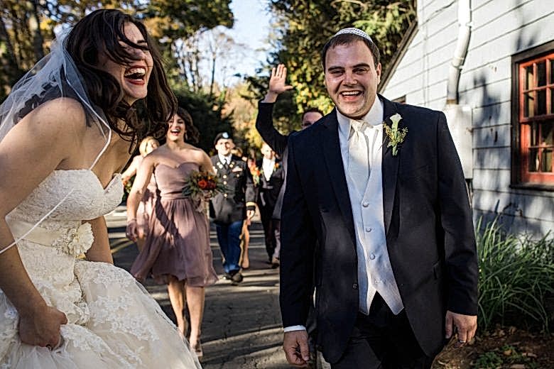 bride and groom laughing on their wedding day