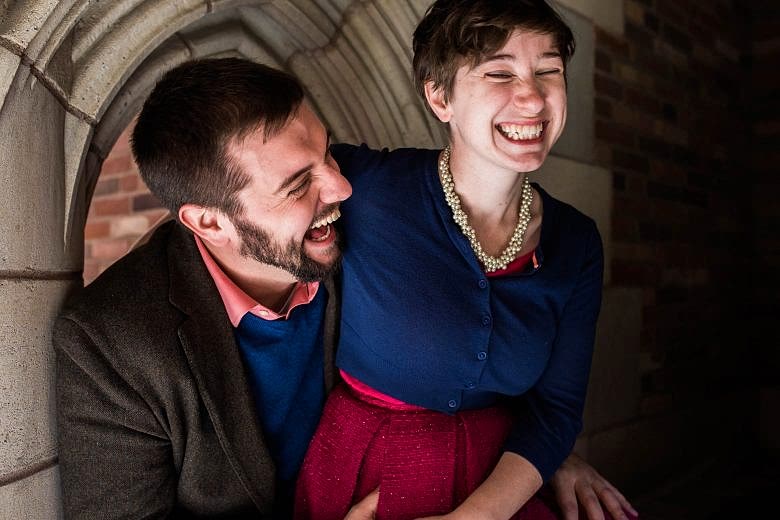 laughing couple sitting together