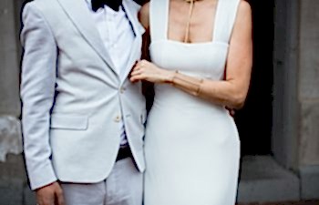 bride and groom standing together in doorway