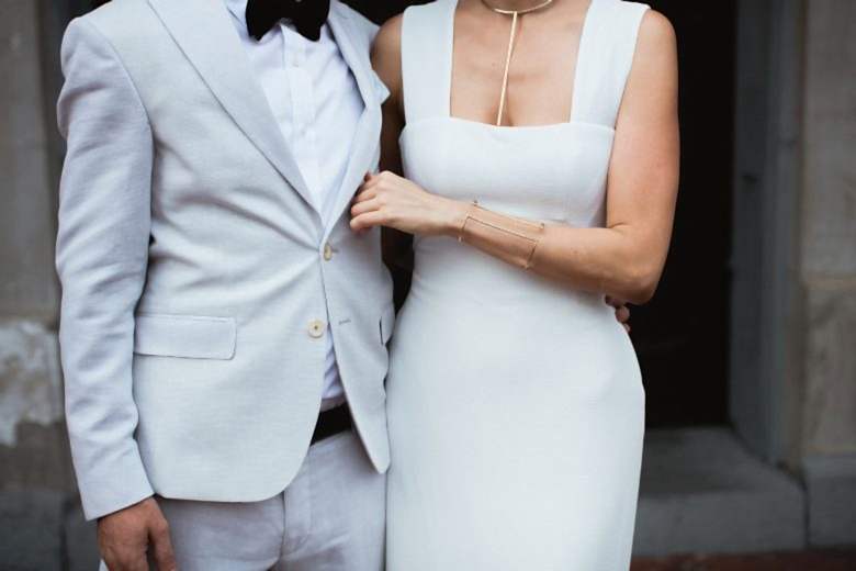 bride and groom standing together in doorway