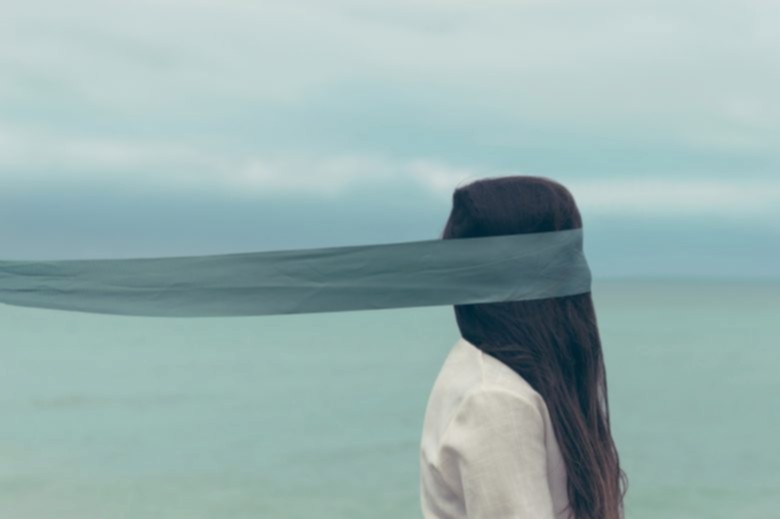 woman with blindfold over her eyes