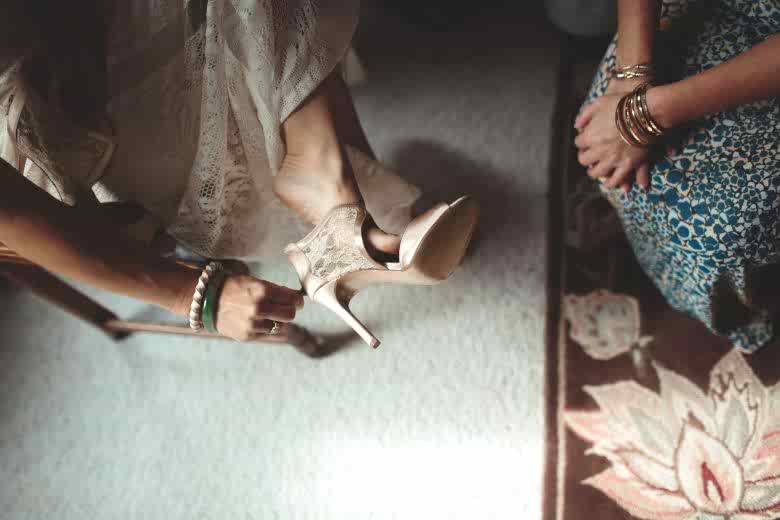 bride putting on her shoes