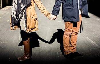 man and woman holding hands