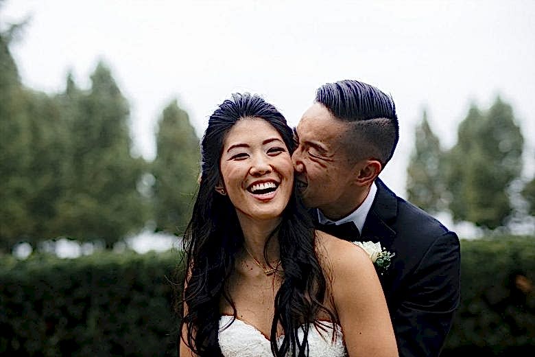 couple laughing together on their wedding day