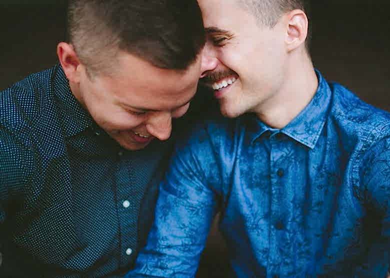 two men laughing together