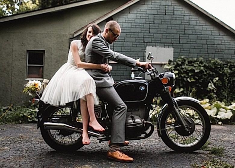 bride and groom on a motorcycle