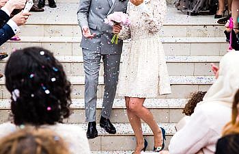 couple walking in confetti