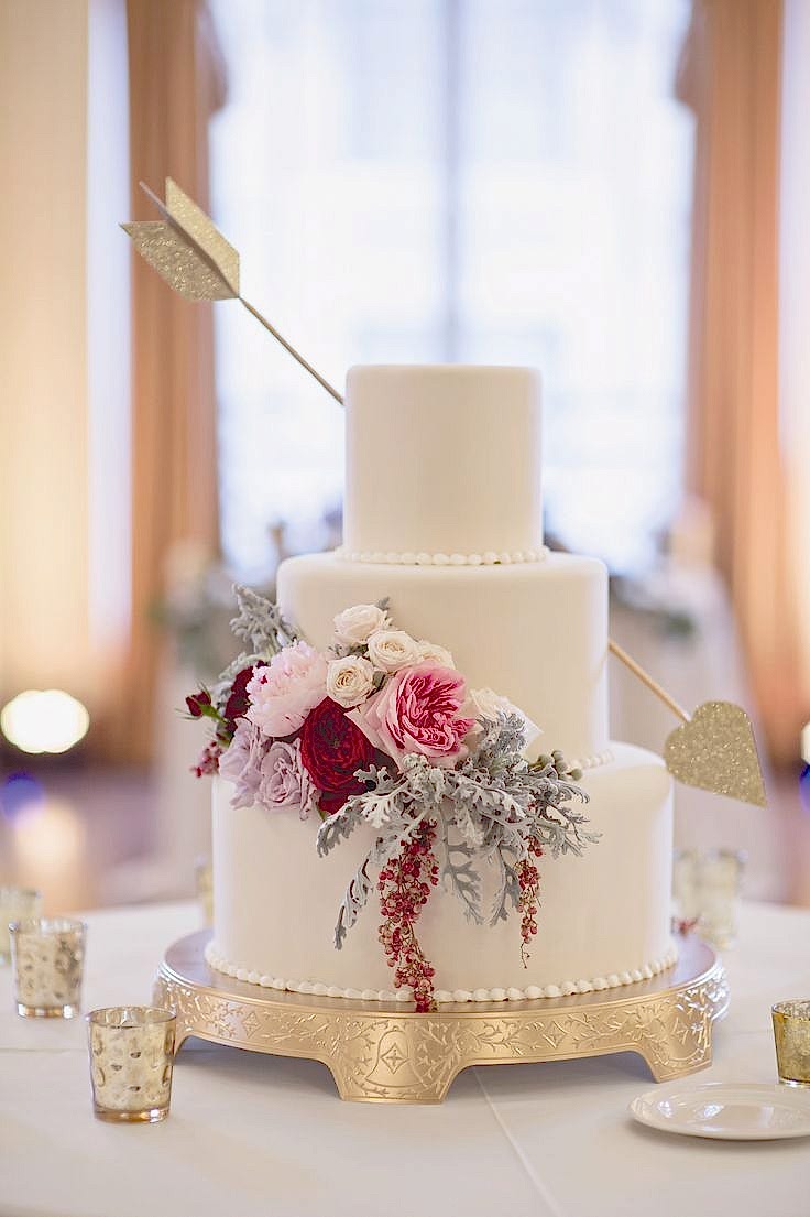 cake with flowers and an arrow