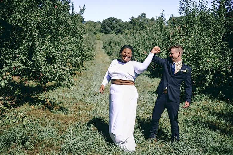 couple dancing in an orchard
