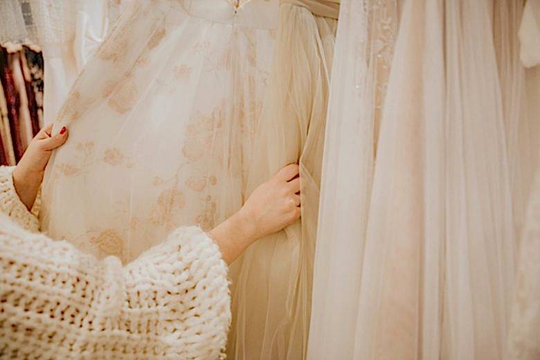 looking through dresses at the BHLDN Palo Alto salon